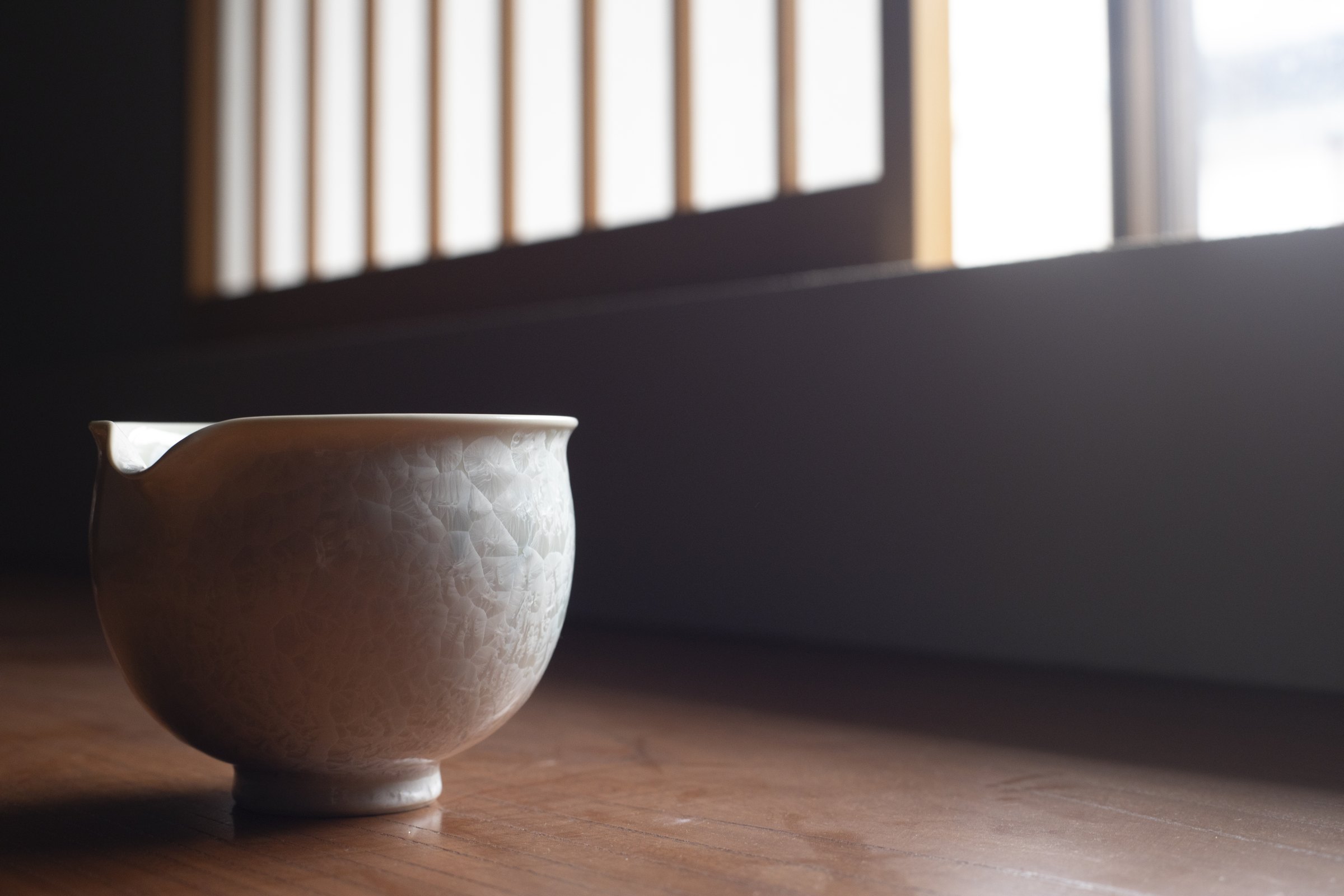 A katakuchi pouring bowl by a lattice window